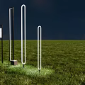 Illuminated Modern Outdoor Lights on Green Grass Night Scene with Various Vertical Shapes