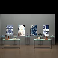 Modern Display Shelves With Glass Countertops Displaying Decorative Items And Blue White Paintings