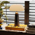 Modern Table Lamp On Stack Of Books With Floral Vase And Window Blinds