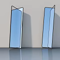 Two Modern Blue Mirrors with Black Frames on Gray Surface Against Light Wall