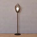 Modern Floor Lamp With Metal Stand And Woven Shade Illuminated In Interior
