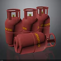 Red Indane Brand LPG Cylinders Standing And Lying On Black Surface
