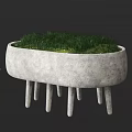 Concrete Garden Ornament With Oval Planter And Multiple Thin Legs Growing Green Grass