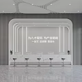 Modern Office Reception Area Featuring Illuminated White Desk Green Plant And Marble Floor