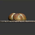 Freshly Baked Golden Brown Braided Bread On Woven Mat Ready For Serving