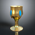 Elegant Golden Decorative Cup With Blue Accents And Intricate Patterned Base