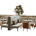 Casual Sofa Set with Curved Design Beige Upholstery Patterned Cushions and Small Round Tables