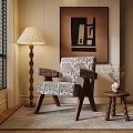 Elegant Living Room With Patterned Armchair Floor Lamp Side Table And Wall Art