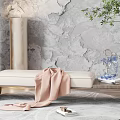 Elegant Footstool With Beige Cushion Pink Blanket Grey Textured Wall And Green Plant Decor