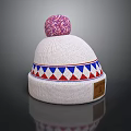 White Knitted Beanie With Pink Pom Pom And Blue Red Geometric Pattern Design