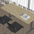 Light Beige Desk With Open Magazine And Black Chairs Near White Curtains On Wooden Floor