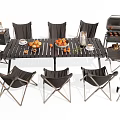 Outdoor Table with Black Folding Chairs Oranges Cups and BBQ Grill for Patio Gatherings