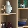 Multi Colored Decorative Cabinets With Shelves Holding Vases Bowls And Home Decor Items