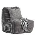 Gray Striped Accent Chair With Black White Checkered Pillow And Throw Blanket