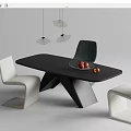 Modern Minimalist Interior Design With Black Table And White Black Chairs Fruit Bowl Hanging Lights