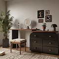 Stylish Dark Dresser with Round Mirror Drawers and Upholstered Stool Near Potted Plant