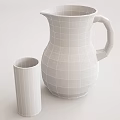 Clear Glass Pitcher with Dark Beverage and Small Glass Cup on White Table