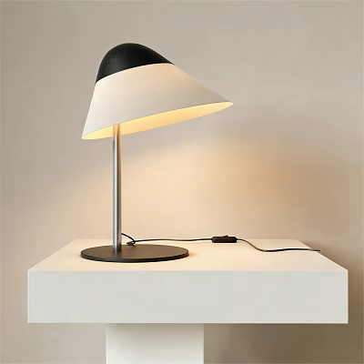 Illuminated Modern Table Lamp With Black And White Shade On White Table 3d model
