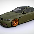 Green BMW Two Door Coupe With Orange Wheels And Sporty Exterior Design