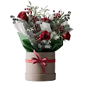 Decorative Ornament Arrangement with Red Roses Green Leaves Berries Pinecones in Cylindrical Box Red Ribbon