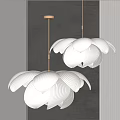 Two White Flower Shaped Chandeliers With Pleated Petals On Dark Wall With Vertical Stripes