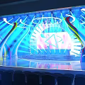 Vibrant Stage Design With Blue Lighting Curved Structures And Auditorium Seats 3d model