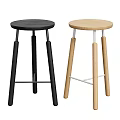 Modern Bar Stools In Black And Light Wood With Round Seats And Cross Supports