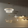 Modern Circular Pendant Lights With Crystal Rings And Metal Frames Displayed On Wall