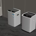 Two Modern White Washing Machines In Laundry Room With Gray Floor And White Walls