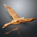 Golden Flying Animal Sculpture With Spread Wings And Reflection On Dark Background