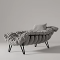 Gray Modern Lounge Chair With Pleated Design and Soft Gray Cushion on Black Metal Legs