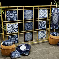 Blue and White Batik Cloths Display on Bamboo Frame With Various Patterns and Baskets 3d model