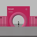Pink Camera Shaped Event Entrance With Tuinwash Brand Round Archway And Person Standing