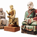 Traditional Buddhist Monk Sculpture Carvings With Sitting Postures And Colorful Details