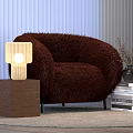 Wooden Table Lamp with Cube Base Beside Brown Furry Armchair and Book Stack