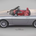 Silver Convertible Sports Car With Red Leather Seats And Alloy Wheels