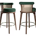 Bar Stools With Green Velvet Seats Woven Rattan Backrests Dark Wooden Legs And Metal Footrests