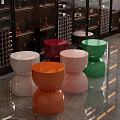 Colorful Round Coffee Tables In Modern Interior With Marble Floor And Display Cabinets