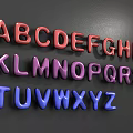 Vibrant 3D Alphabet Letters in Red Purple Blue Displayed on Dark Background