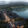 Traditional Lakeside Commercial Street with Illuminated Buildings and Scenic Night Atmosphere