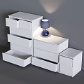 Modern White Chest of Drawers with Multiple Drawers and Blue Table Lamp