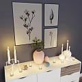 Modern Entryway Cabinet Sideboard With Decorations Candles Vase Green Plant And Wall Paintings
