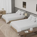 Hotel Guest Room Featuring Twin Beds White Linens Pillows Table Lamps And Decorative Paintings