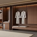 Modern Wooden Wardrobe Interior Design With Hanging Rod And White Bathrobes
