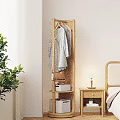 Wooden Coat Rack With Hanging Clothes Handbag Near Bedroom Bedside Table Lamp And Green Plant