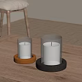 Decorative Ornament Set With White Candles Transparent Holders And Orange Black Bases On Wooden Table