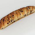 Freshly Baked Long Loaf Bread With Dark Raisins And Golden Crust