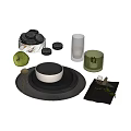 Black Dinnerware Combination With Plates Bowl Woven Placemat Gold Cutlery And Green Accents