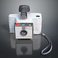 Vintage Digital Camera Featuring White Body Black Lens And Leather Strap