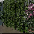 Indoor Lush Green Plant Wall With Pink White Flowers And Potted Plants